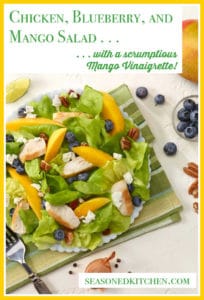 White plate filled with Chicken, Blueberry and Mango Salad
