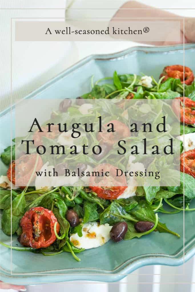 closer shot of arugula and tomato salad formatted for sharing