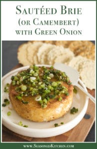 Round white dish holding a small wheel of Sautéed Brie cheese topped with green onions.