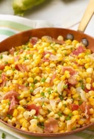 Copper skillet filled with Corn and Prosciutto Salad
