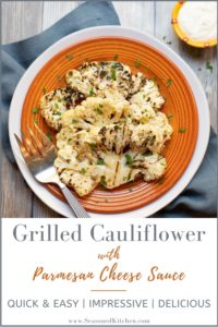 Orange plate showing two slices of Grilled Cauliflower with Parmesan Cheese Sauce