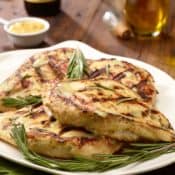 white plate with Grilled Rosemary-Dijon Chicken Breassts