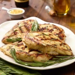 white plate with Grilled Rosemary-Dijon Chicken Breasts