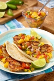 Plate with two Grilled Shrimp Tacos with Tomato-Mango Salsa