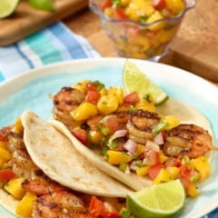 Plate with two Grilled Shrimp Tacos with Tomato-Mango Salsa