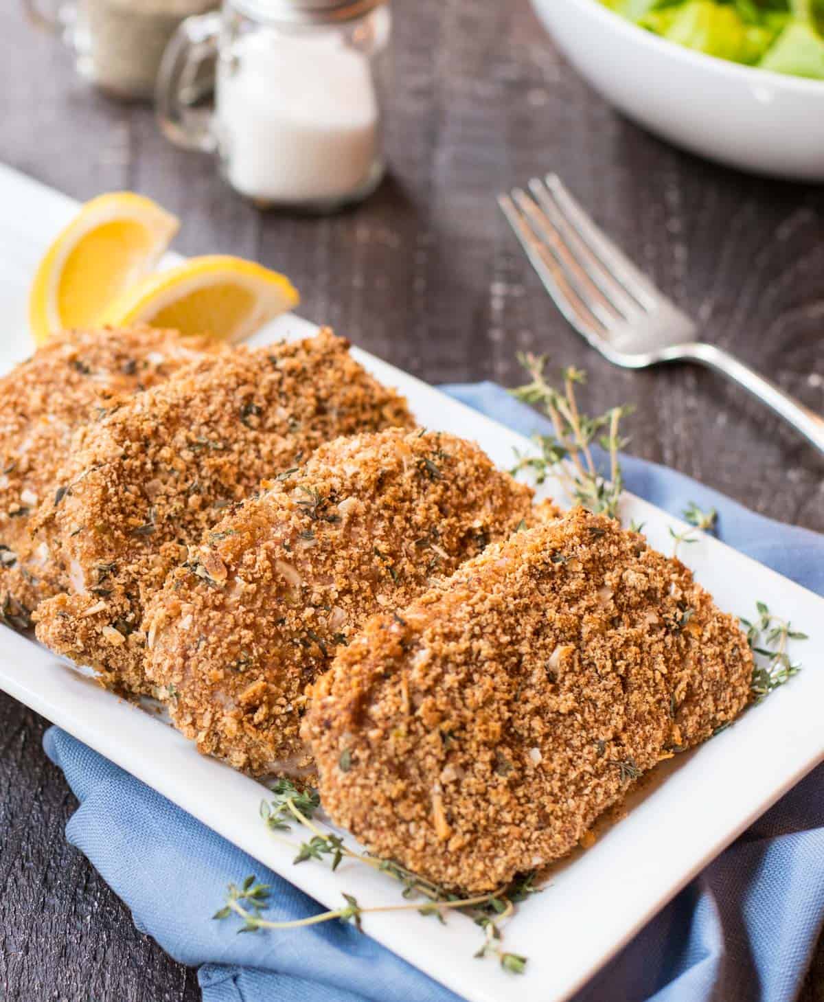 White platter with four Healthy Breaded Pork Chops