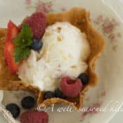 Pecan Cookie Cup with a scoop of Lemon Almond Ice Cream with berries