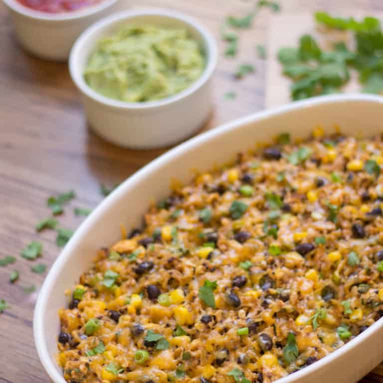 Oval white baking dish filled with Mexican Chicken Black Beans and Rice