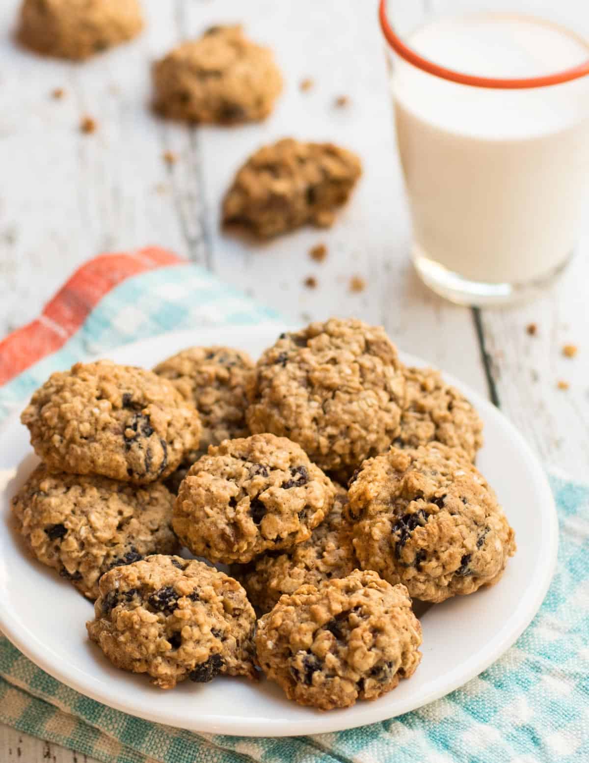 Mini Oatmeal Raisin Cookies with a glass of milk
