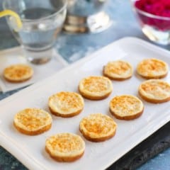 Onion Parmesan Toasts on white platter