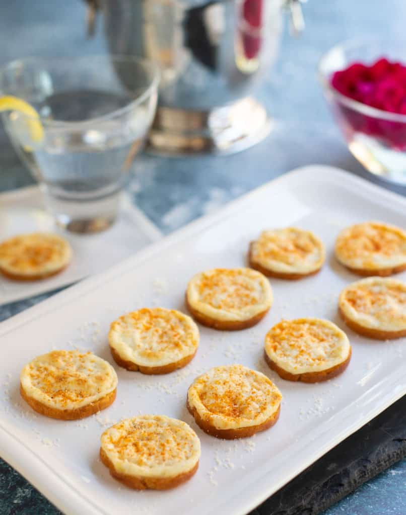 Onion Parmesan Toasts on white platter