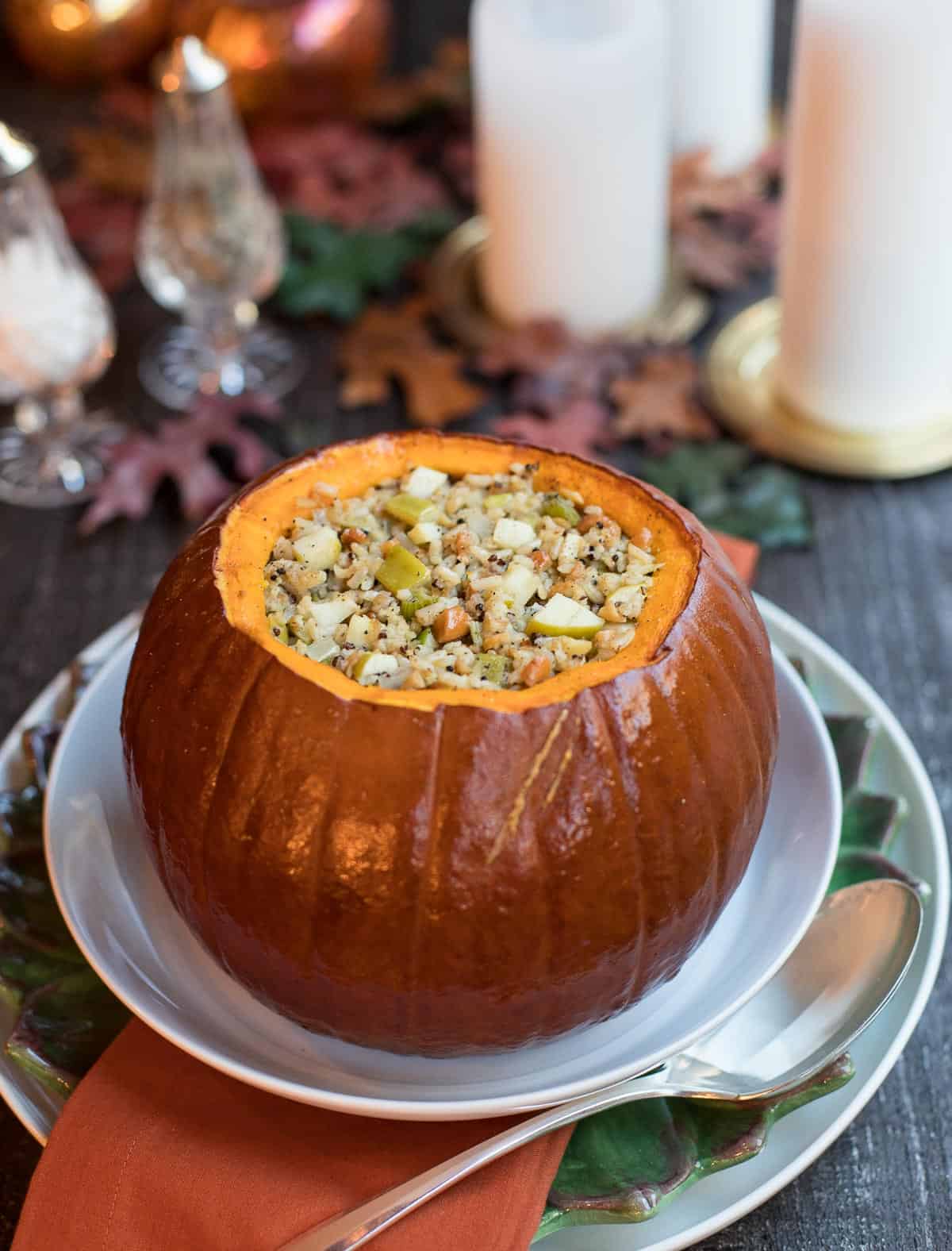 Roasted Pumpkin with Apple-Cashew Stuffing on a large round white platter