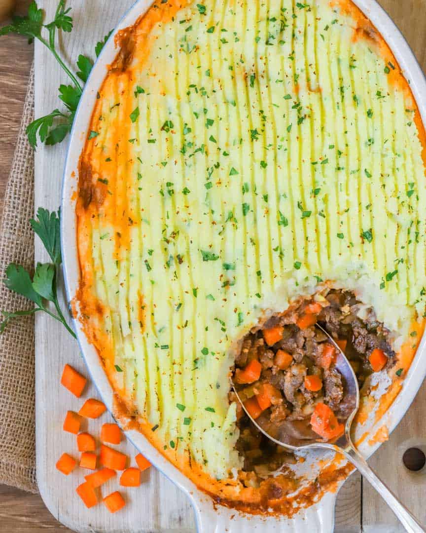overhead shot of Shepherd's PIe, with a corner scooped out showing the filling