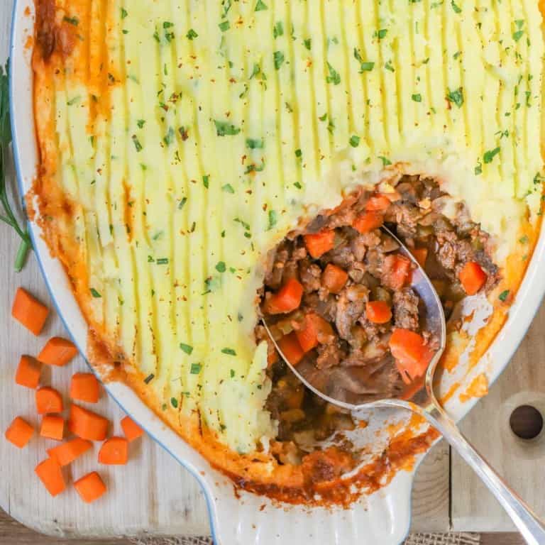 overhead shot of Shepherd's PIe, with a corner scooped out showing the filling