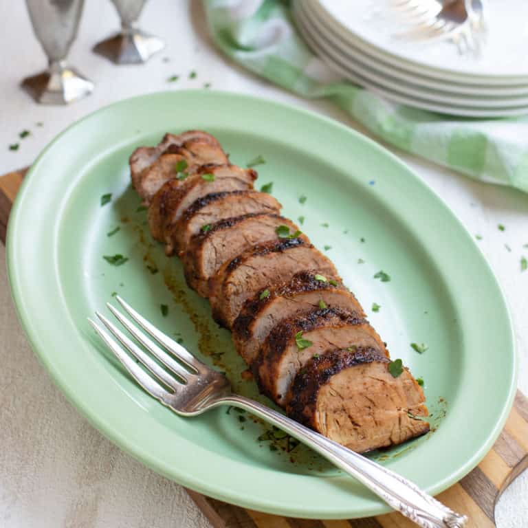 spicy rubbed pork tenderloin, sliced and served on a platter