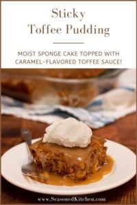 white plate showing a slice of Sticky Toffee Pudding with rum whipped cream on top