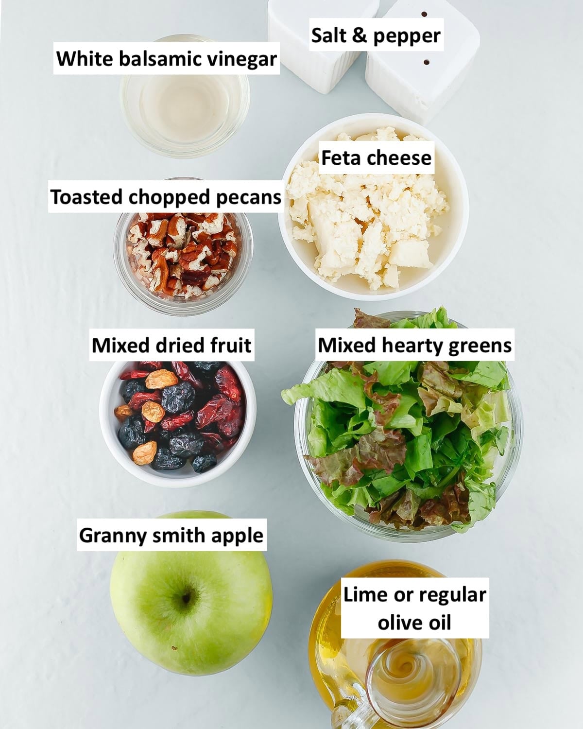 Apple feta salad ingredients in bowls with text labels.