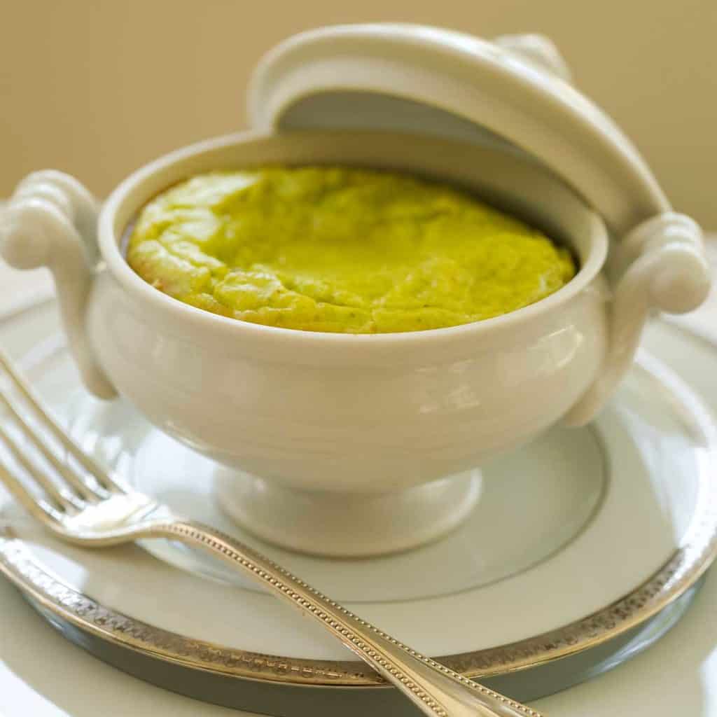 Single serving of Asparagus Soufflé in a white lidded dish