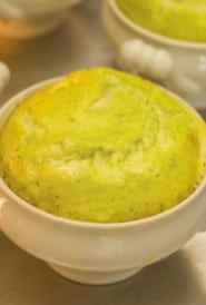 close up of white dish showing individual cooked Asparagus Soufflé