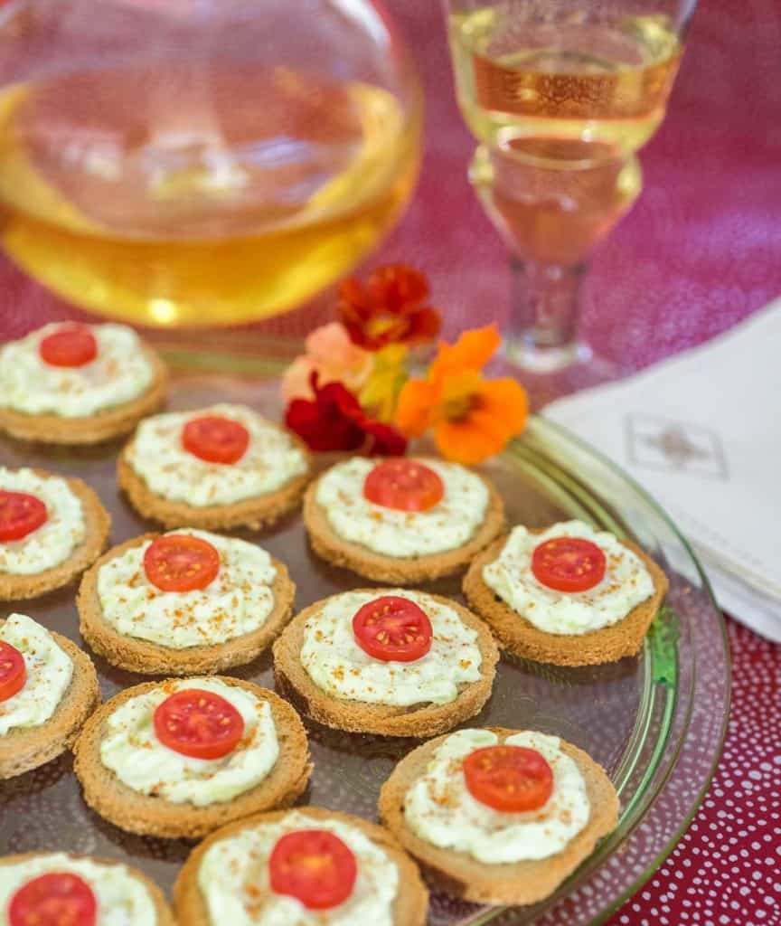 glass platter filled with Benedictine Cheese Spread on toast rounds