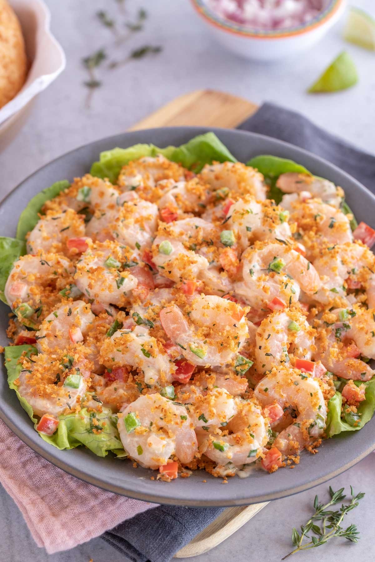 Dark blue plate holding Shrimp Salad with Lime Herb Dressing