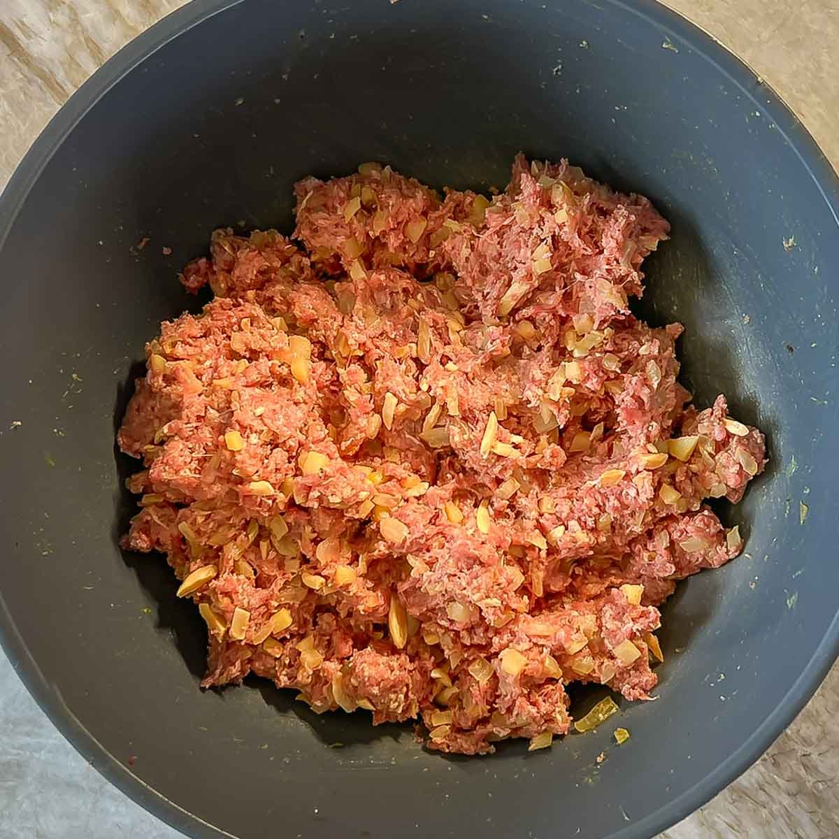 Bobotie ground meat mixture in a blue bowl