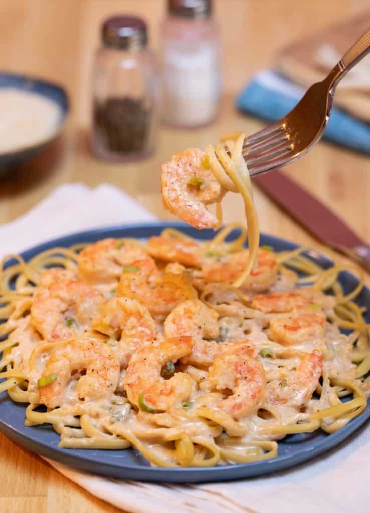 Blue plate filled with Quick and Easy Cajun Shrimp Linguine
