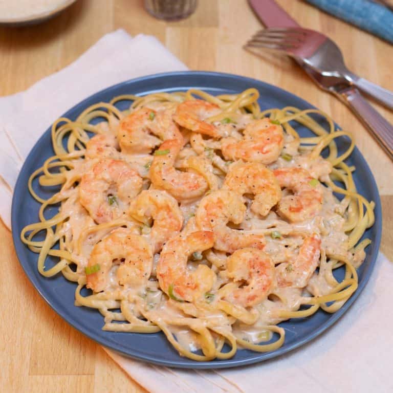 Blue plate filled with Quick and Easy Cajun Shrimp Linguine
