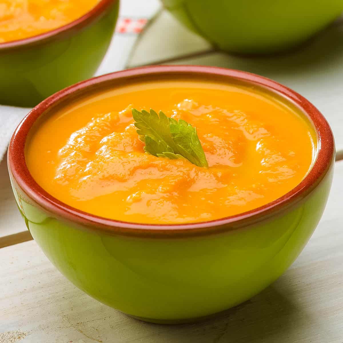 close up of one bowl of Creamy Carrot Soup.
