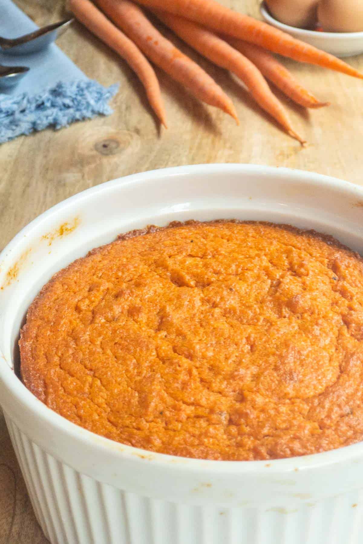 white souffle dish filled with Roasted Carrot Souffle