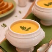 White footed soup bowl filled with Carrot Vichyssoise