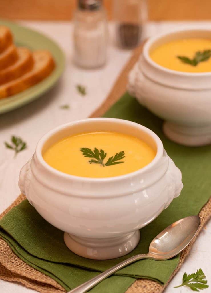 White footed soup bowl filled with Carrot Vichyssoise