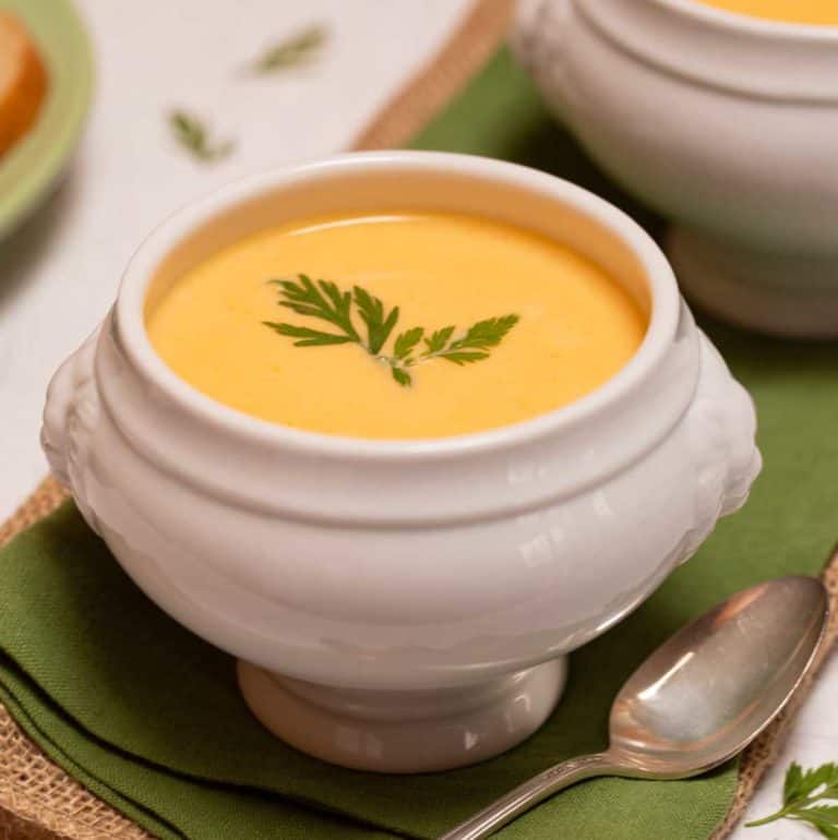 White footed bowl filled with Carrot Vichyssoise