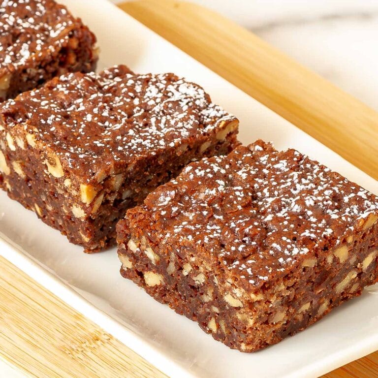 Close up of 2 Chewy Chocolate Brownies on a white platter