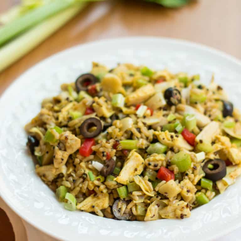 round white shallow bowl filled with Chicken, Artichoke Hearts, Quinoa and Brown Rice Salad