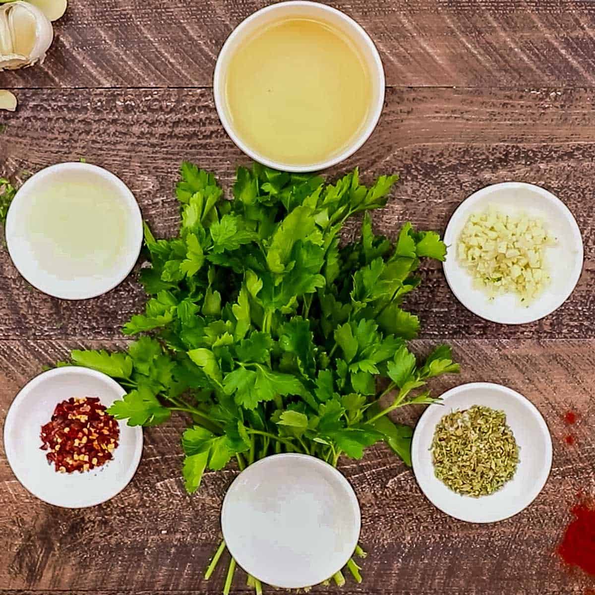 Overhead showing all the ingredients in Chimichurri Sauce.