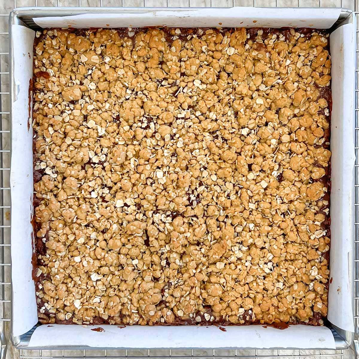 Baked, done cookies in baking dish, showing golden brown top