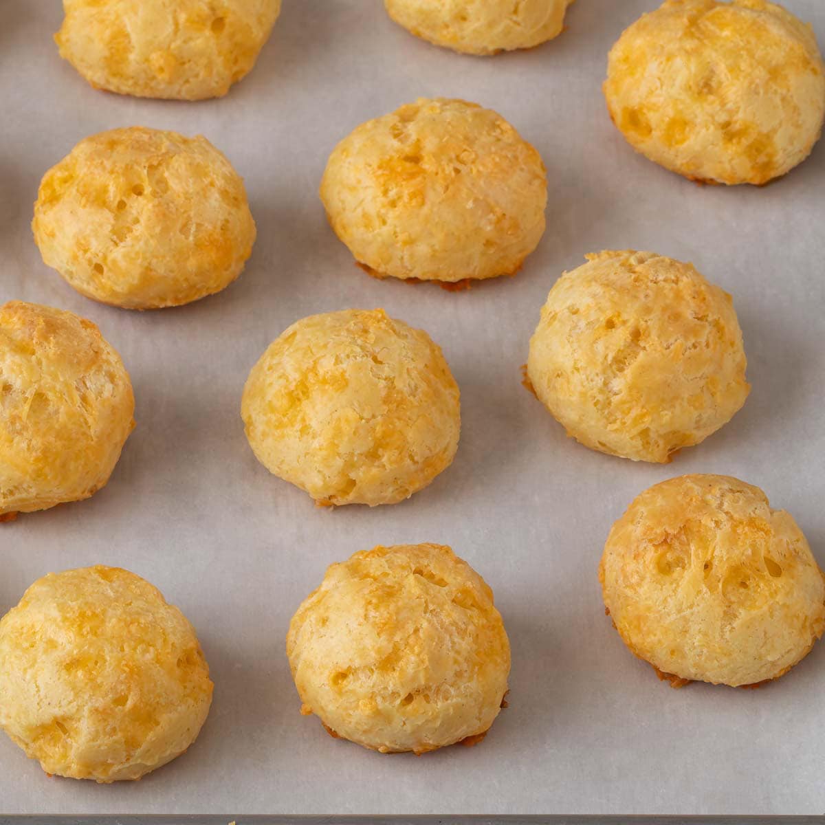 Choux pastry baked into Cheddar gougères