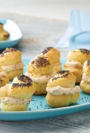 Choux pastry baked into poppy seed puffs and filled with smoked salmon spread