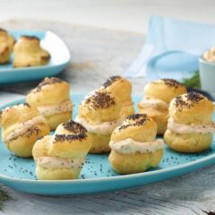 Choux pastry baked into poppy seed puffs and filled with smoked salmon spread