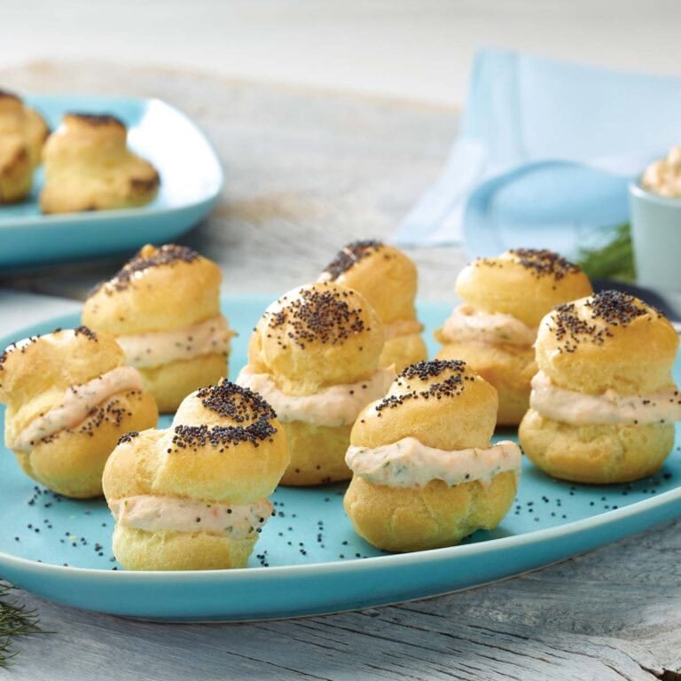 Choux pastry baked into poppy seed puffs and filled with smoked salmon spread
