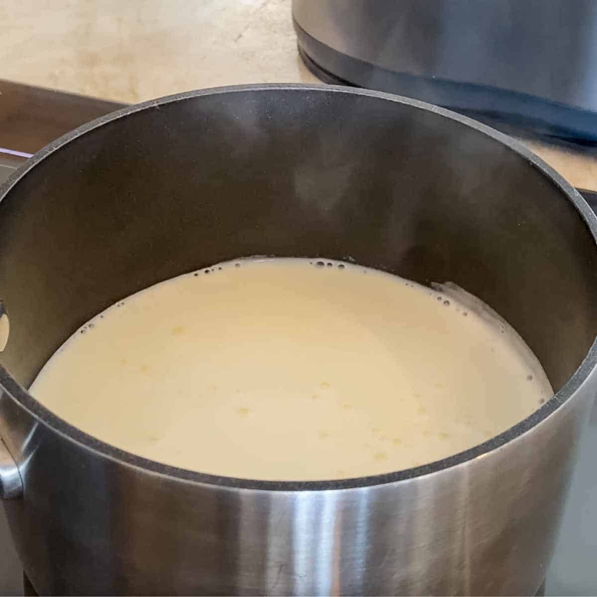 shows scalded milk - steaming and bubbling but not at a full boil
