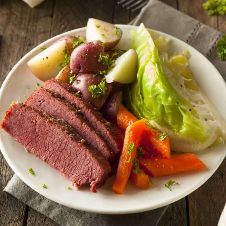 white plate with Mom's Corned Beef and Cabbage