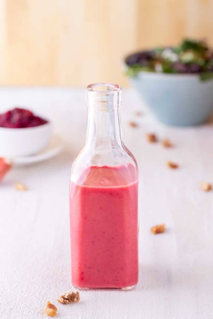 Clear glass bottle showing Cranberry Vinaigrette