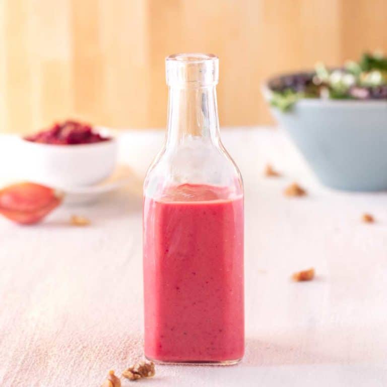 Clear glass bottle showing Cranberry Vinaigrette