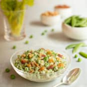 glass bowl filled with Curried Pea Salad with Bacon and Cashews