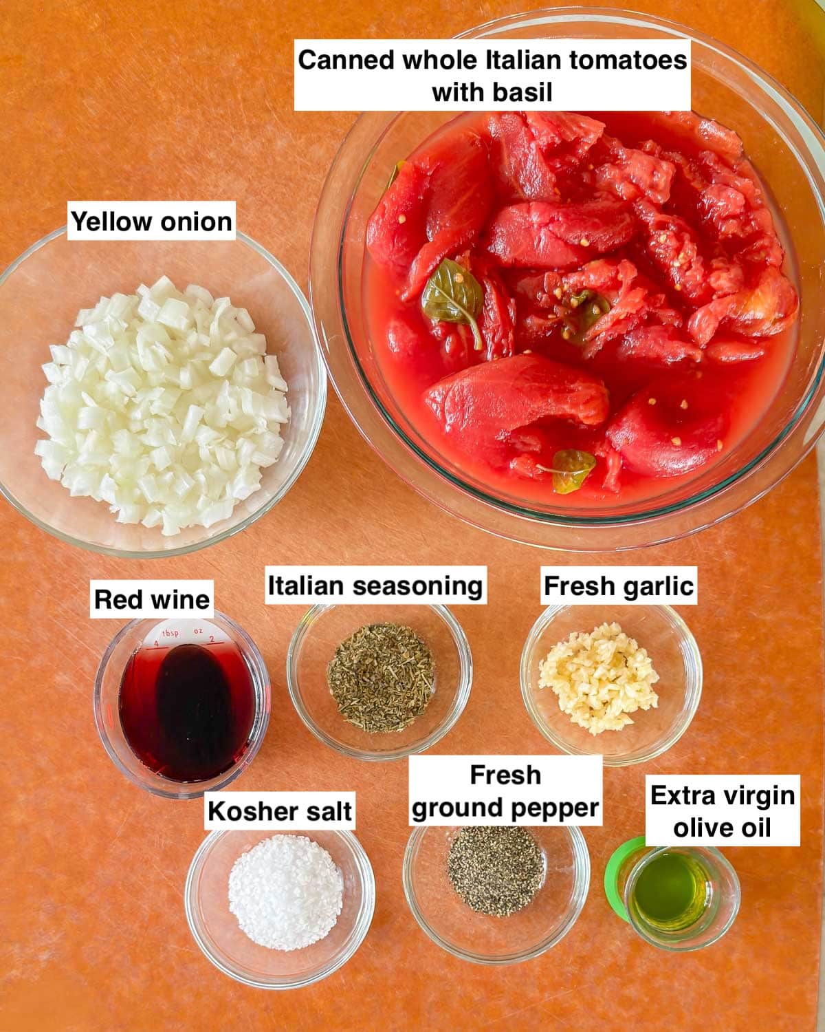 Board holding all 8 ingredients in easy homemade marinara sauce.
