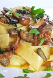 White plate with a large portion of Quick Eggplant and Mushroom Pappardelle.