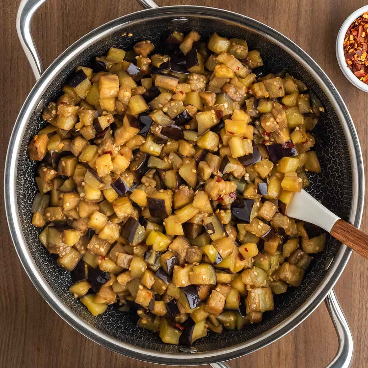 Eggplant cooked in a skillet.