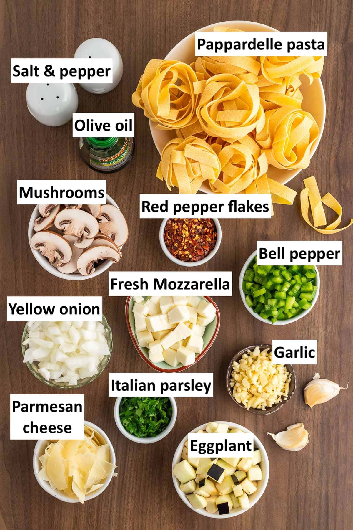 Ingredients to make eggplant mushroom pasta on the table.